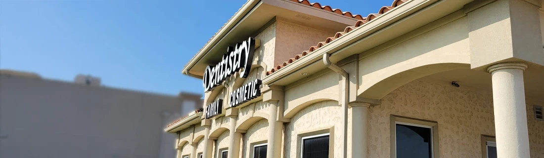 Dentist Flower Mound TX About Us Hero the front of the Fountain Park Dentistry building while facing the sunshine is shown