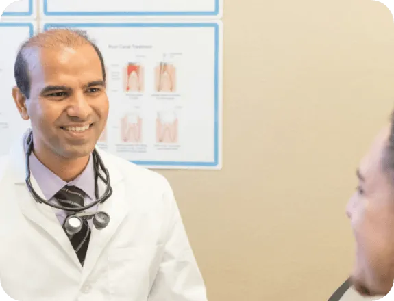 Dentist Flower Mound TX Girish Chaudhari Meeting With Patient HP Fountain Park Dental dentist, Girish Chaudhari, is seen meeting with a patient